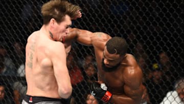 DALLAS, TX - SEPTEMBER 08: (R-L) Tyron Woodley punches Darren Till of England in their UFC welterweight championship fight during the UFC 228 event at American Airlines Center on September 8, 2018 in Dallas, Texas. (Photo by Josh Hedges/Zuffa LLC/Zuffa LLC via Getty Images)