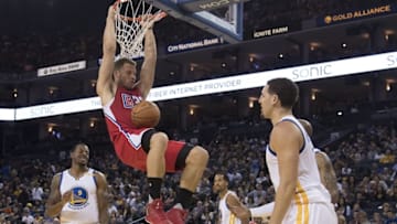 October 4, 2016; Oakland, CA, USA; Los Angeles Clippers forward Blake Griffin (32) dunks the basketball against Golden State Warriors guard Klay Thompson (11) during the second quarter at Oracle Arena. Mandatory Credit: Kyle Terada-USA TODAY Sports