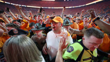 KNOXVILLE, TENNESSEE - OCTOBER 15: Head coach Josh Heupel of the Tennessee Volunteers celebrates a win over the Alabama Crimson Tide with a cigar at Neyland Stadium on October 15, 2022 in Knoxville, Tennessee. Tennessee won the game 52-49. (Photo by Donald Page/Getty Images)