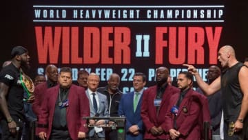 Deontay Wilder (L) and British boxer Tyson Fury (R) face off. (Photo by MARK RALSTON/AFP via Getty Images)