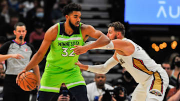 Minnesota Timberwolves center Karl-Anthony Towns controls the ball against New Orleans Pelicans center Jonas Valanciunas. Mandatory Credit: Jeffrey Becker-USA TODAY Sports