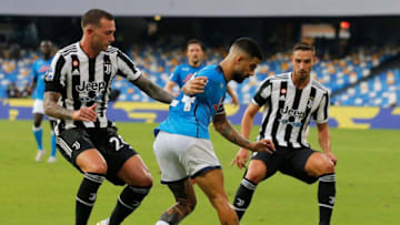 Napoli's Italian forward Lorenzo Insigne (C) fights for the ball with Juventus' Italian forward Federico Bernardeschi (L) and Juventus' Italian defender Mattia De Sciglio (R) during the Serie A football match beetween Napoli and Juventus at The Maradona Stadium in Naples on September 11, 2021. (Photo by Carlo Hermann / AFP) (Photo by CARLO HERMANN/AFP via Getty Images)