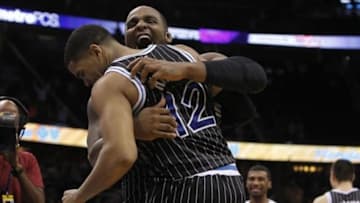 Feb 7, 2014; Orlando, FL, USA; Orlando Magic small forward Tobias Harris (12) celebrates with power forward Glen Davis (11) after scoring against the Oklahoma City Thunder during the second half at Amway Center. The Orlando Magic won 103-102. Mandatory Credit: Kim Klement-USA TODAY Sports