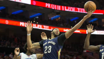 Dec 20, 2016; Philadelphia, PA, USA; New Orleans Pelicans forward Anthony Davis (23) rebounds the ball in front of Philadelphia 76ers center Joel Embiid (21) during the second half at Wells Fargo Center. The New Orleans Pelicans won 108-93. Mandatory Credit: Bill Streicher-USA TODAY Sports