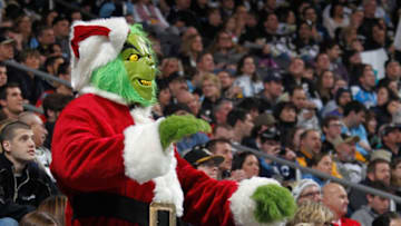 PITTSBURGH, PA - DECEMBER 21: A fan dressed as the Grinch watches the Pittsburgh Penguins during the first period against the Calgary Flames on December 21, 2013 at Consol Energy Center in Pittsburgh, Pennsylvania. (Photo by Gregory Shamus/NHLI via Getty Images)