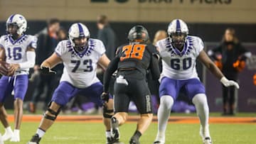 Nov 13, 2021; Stillwater, Oklahoma, USA; TCU Horned Frogs guard Blake Hickey (73) and offensive tackle Tyler Guyton (60) block Oklahoma State Cowboys linebacker Mason Cobb (38) during the fourth quarter at Boone Pickens Stadium. OSU won 63-17. Mandatory Credit: Brett Rojo-USA TODAY Sports