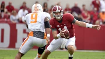Oct 24, 2015; Tuscaloosa, AL, USA; Alabama Crimson Tide quarterback Jake Coker (14) under pressure from Tennessee Volunteers defensive end Derek Barnett (9) during the second quarter at Bryant-Denny Stadium. Mandatory Credit: John David Mercer-USA TODAY Sports