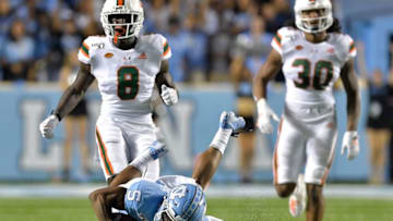 CHAPEL HILL, NORTH CAROLINA - SEPTEMBER 07: Dazz Newsome #5 of the North Carolina Tar Heels dives to make a catch in front of DJ Ivey #8 and Romeo Finley #30 of the Miami Hurricanes look oon during the second half of their game at Kenan Stadium on September 07, 2019 in Chapel Hill, North Carolina. North Carolina won 28-25. (Photo by Grant Halverson/Getty Images)