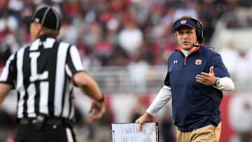 Nov 26, 2016; Tuscaloosa, AL, USA; Auburn Tigers head coach Gus Malzahn talks with the line judges during the second quarter against the Alabama Crimson Tide at Bryant-Denny Stadium. Mandatory Credit: John David Mercer-USA TODAY Sports