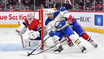MONTREAL, CANADA - NOVEMBER 22: Alex Tuch #89 of the Buffalo Sabres skates the puck around the net near goaltender Jake Allen #34 of the Montreal Canadiens during the third period at Centre Bell on November 22, 2022 in Montreal, Quebec, Canada. The Buffalo Sabres defeated the Montreal Canadiens 7-2. (Photo by Minas Panagiotakis/Getty Images)
