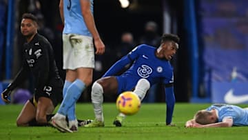 Chelsea's English midfielder Callum Hudson-Odoi (C) reacts after scoring their late goal during the English Premier League football match between Chelsea and Manchester City at Stamford Bridge in London on January 3, 2021. - Manchester City won the game 3-1. (Photo by Andy Rain / POOL / AFP) / RESTRICTED TO EDITORIAL USE. No use with unauthorized audio, video, data, fixture lists, club/league logos or 'live' services. Online in-match use limited to 120 images. An additional 40 images may be used in extra time. No video emulation. Social media in-match use limited to 120 images. An additional 40 images may be used in extra time. No use in betting publications, games or single club/league/player publications. / (Photo by ANDY RAIN/POOL/AFP via Getty Images)