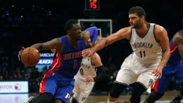 Nov 29, 2015; Brooklyn, NY, USA; Brooklyn Nets center Brook Lopez (11) defends against Detroit Pistons guard Reggie Jackson (1) during second half at Barclays Center. The Brooklyn Nets defeated the Detroit Pistons 87-83.Mandatory Credit: Noah K. Murray-USA TODAY Sports