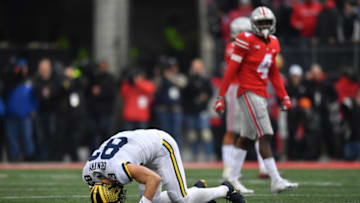 COLUMBUS, OH - NOVEMBER 24: Zach Gentry #83 of the Michigan Wolverines lies on the field after being injured while trying to make a reception in the third quarter against the Ohio State Buckeyes at Ohio Stadium on November 24, 2018 in Columbus, Ohio. Ohio State defeated Michigan 62-39. (Photo by Jamie Sabau/Getty Images)