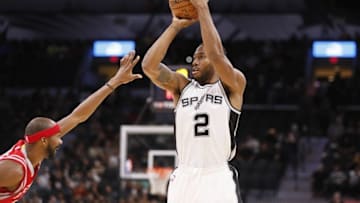Oct 21, 2016; San Antonio, TX, USA; San Antonio Spurs small forward Kawhi Leonard (2) shoots the ball over Houston Rockets small forward Corey Brewer (33) during the first half at AT&T Center. Mandatory Credit: Soobum Im-USA TODAY Sports