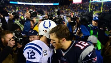 Jan 11, 2014; Foxborough, MA, USA; New England Patriots quarterback Tom Brady (12) shakes hands with Andrew Luck (12) after the 2013 AFC divisional playoff football game at Gillette Stadium. Mandatory Credit: Andrew Weber-USA TODAY Sports