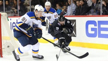 Dec 4, 2015; Brooklyn, NY, USA; New York Islanders defenseman Nick Leddy (2) and St. Louis Blues right wing Vladimir Tarasenko (91) battle for the puck during overtime at Barclays Center. New York Islanders won 2-1 in shootout. Mandatory Credit: Anthony Gruppuso-USA TODAY Sports