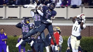 Dec 4, 2014; Greenville, NC, USA; Central Florida Knights wide receiver Breshad Perriman (11) catches the game winning touchdown pass against East Carolina Pirates linebacker Dayon Pratt (1) and defensive back Domonique Lennon (31) during the 4th quarter at Dowdy-Ficklen Stadium. The Central Florida Knights defeated the East Carolina Pirates 32-30. Mandatory Credit: James Guillory-USA TODAY Sports