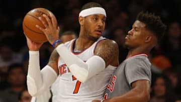 Dec 19, 2015; New York, NY, USA; New York Knicks forward Carmelo Anthony (7) looks to make a move on Chicago Bulls guard Jimmy Butler (21) during second half at Madison Square Garden. The New York Knicks defeated the Chicago Bulls 107-91. Mandatory Credit: Noah K. Murray-USA TODAY Sports