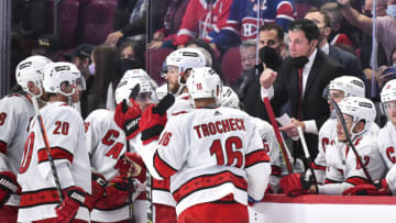 MONTREAL, QC - OCTOBER 21: Head coach of the Carolina Hurricanes Rod Brind'Amour gathers his players around the bench during the third period against the Montreal Canadiens at Centre Bell on October 21, 2021 in Montreal, Canada. The Carolina Hurricanes defeated the Montreal Canadiens 4-1. (Photo by Minas Panagiotakis/Getty Images)