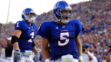 Sep 5, 2009; Lawrence, KS, USA; Kansas Jayhawks quarterback Todd Reesing (5) celebrates after scoring a touchdown against the Northern Colorado Bears in the first quarter at Memorial Stadium. Mandatory Credit: John Rieger-USA TODAY Sports