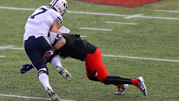 Nov 5, 2016; Cincinnati, OH, USA; Brigham Young Cougars quarterback Taysom Hill (7) is tackled by Cincinnati Bearcats safety Zach Edwards (4) in the second half at Nippert Stadium. Brigham Young won 20-3. Mandatory Credit: Aaron Doster-USA TODAY Sports