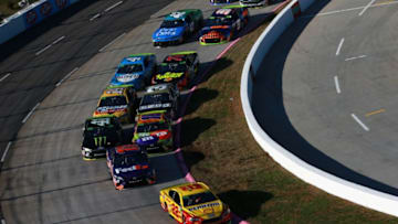 MARTINSVILLE, VA - OCTOBER 28: Joey Logano, driver of the #22 Shell Pennzoil Ford, leads a pack of cars during the Monster Energy NASCAR Cup Series First Data 500 at Martinsville Speedway on October 28, 2018 in Martinsville, Virginia. (Photo by Sean Gardner/Getty Images)