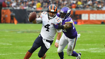 CHICAGO, ILLINOIS - SEPTEMBER 29: Chase Daniel #4 of the Chicago Bears is brought down by Danielle Hunter #99 of the Minnesota Vikings during the first half at Soldier Field on September 29, 2019 in Chicago, Illinois. (Photo by Stacy Revere/Getty Images)