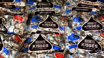 HERSHEY, PA - AUGUST 7: Bags of Hershey Kisses sit on a shelf at a store on August 7, 2002 in Hershey, Pennsylvania. The Hershey Trust said Wednesday after a special meeting of its board that it will continue to explore selling the company despite criticism from the state's political and business leaders. (Photo by Spencer Platt/Getty Images)