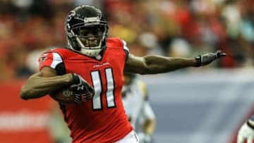Sep 15, 2013; Atlanta, GA, USA; Atlanta Falcons wide receiver Julio Jones (11) makes a catch for a touchdown with coverage by St. Louis Rams cornerback Janoris Jenkins (21) in the first quarter at the Georgia Dome. Mandatory Credit: Daniel Shirey-USA TODAY Sports