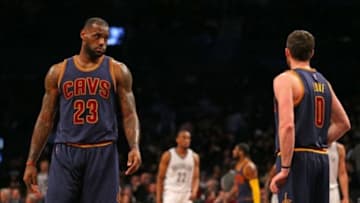 Mar 27, 2015; Brooklyn, NY, USA; Cleveland Cavaliers forward LeBron James (23) looks towards forward Kevin Love (0) against the Brooklyn Nets during the second half at Barclays Center. The Nets defeated the Cavaliers 106 - 98. Mandatory Credit: Adam Hunger-USA TODAY Sports
