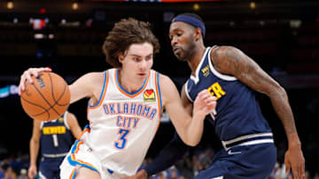 OKC Thunder guard Josh Giddey (3) drives to the basket against Denver Nuggets forward Will Barton (5): Alonzo Adams-USA TODAY Sports