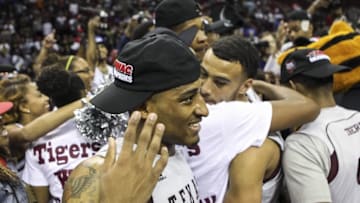 Mar 14, 2015; Houston, TX, USA; Texas Southern Tigers guard Madarious Gibbs (3) celebrates with teammates after winning the championship game of the SWAC Conference Tournament against the Southern University Jaguars at Toyota Center. The Tigers defeated the Jaguars 62-58. Mandatory Credit: Troy Taormina-USA TODAY Sports
