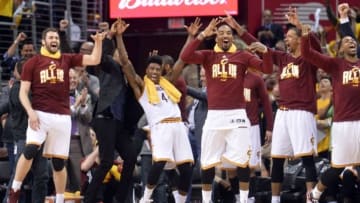 May 4, 2016; Cleveland, OH, USA; The Cleveland Cavaliers bench, including forward Kevin Love (0), guard Iman Shumpert (4), guard J.R. Smith (5), and center Tristan Thompson (13) celebrate Cleveland Cavaliers guard Mo Williams' (52) three-pointer during the fourth quarter in game two of the second round of the NBA Playoffs at Quicken Loans Arena. The three-pointer was the 25th of the game for the Cavs. The Cavs won 123-98. Mandatory Credit: Ken Blaze-USA TODAY Sports