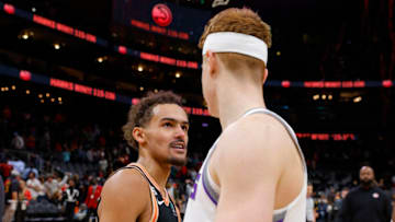 ATLANTA, GA - NOVEMBER 23: Kevin Huerter #9 of the Sacramento Kings speaks to Trae Young #11 of the Atlanta Hawks at the conclusion of the Atlanta Hawks 115-106 victory over the Sacramento Kings at State Farm Arena on November 23, 2022 in Atlanta, Georgia. NOTE TO USER: User expressly acknowledges and agrees that, by downloading and or using this photograph, User is consenting to the terms and conditions of the Getty Images License Agreement. (Photo by Todd Kirkland/Getty Images)