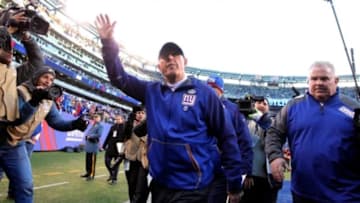 Jan 3, 2016; East Rutherford, NJ, USA; New York Giants head coach Tom Coughlin (C) waves to fans while walking off the field after the game against the Philadelphia Eagles at MetLife Stadium. The Eagles won 35-30. Mandatory Credit: Brad Penner-USA TODAY Sports