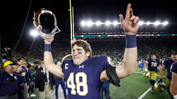SOUTH BEND, IN - OCTOBER 21: Greer Martini #48 of the Notre Dame Fighting Irish celebrates after a 49-14 win against the USC Trojans at Notre Dame Stadium on October 21, 2017 in South Bend, Indiana. (Photo by Joe Robbins/Getty Images)