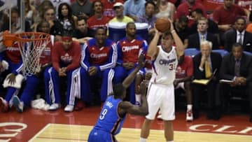 May 15, 2014; Los Angeles, CA, USA; Los Angeles Clippers forward Blake Griffin (32) shoots against Oklahoma City Thunder forward Serge Ibaka (9)during the first quarter in game six of the second round of the 2014 NBA Playoffs at Staples Center. Mandatory Credit: Kelvin Kuo-USA TODAY Sports