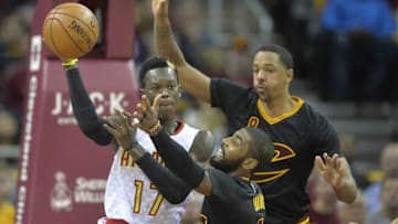 Nov 8, 2016; Cleveland, OH, USA; Atlanta Hawks guard Dennis Schroder (17) looks to pass the ball as Cleveland Cavaliers guard Kyrie Irving (2) and forward Channing Frye (8) defend in the first quarter at Quicken Loans Arena. Mandatory Credit: David Richard-USA TODAY Sports