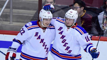 Dec 29, 2016; Glendale, AZ, USA; New York Rangers defenseman Nick Holden (22) celebrates with center J.T. Miller (10) after scoring a power play goal in the first period against the Arizona Coyotes at Gila River Arena. Mandatory Credit: Matt Kartozian-USA TODAY Sports