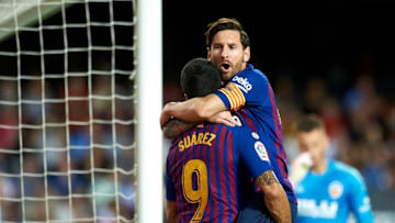 Leo Messi celebrates goal with teammates Luis Suarez during the week 8 of La Liga match between Valencia CF and FC Barcelona at Mestalla Stadium in Valencia, Spain on October 7, 2018. (Photo by Jose Breton/NurPhoto via Getty Images)