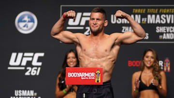 Apr 23, 2021; Jacksonville, Florida, USA; Pat Sabatini flexes while on the scale during weigh-ins for UFC 261 at VyStar Veterans Memorial Arena. Mandatory Credit: Jasen Vinlove-USA TODAY Sports