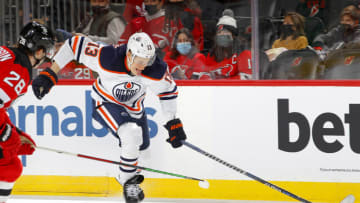 Jesse Puljujarvi #13 of the Edmonton Oilers in action against the New Jersey Devils at Prudential Center on December 31, 2021 in Newark, New Jersey. The Devils defeated the Oilers 6-5 in overtime. (Photo by Jim McIsaac/Getty Images)