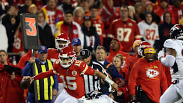KANSAS CITY, MISSOURI - DECEMBER 05: Patrick Mahomes #15 of the Kansas City Chiefs scrambles as Bradley Chubb #55 of the Denver Broncos chases during the game at Arrowhead Stadium on December 05, 2021 in Kansas City, Missouri. (Photo by Jamie Squire/Getty Images)