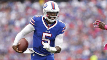 Oct 16, 2016; Orchard Park, NY, USA; Buffalo Bills quarterback Tyrod Taylor (5) runs with the ball for a first down during the first half against the San Francisco 49ers at New Era Field. Mandatory Credit: Kevin Hoffman-USA TODAY Sports