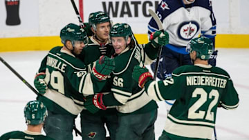 Oct 15, 2016; Saint Paul, MN, USA; Minnesota Wild defenseman Jonas Brodin (25) celebrates his goal with teammates during the third period against the Winnipeg Jets at Xcel Energy Center. The Wild defeated the Jets 4-3. Mandatory Credit: Brace Hemmelgarn-USA TODAY Sports