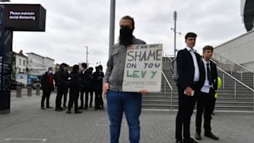 LONDON, ENGLAND - APRIL 21: Tottenham Hotspur fans protest against chairman of the club, Daniel Levy and the European Super League prior to the Premier League match between Tottenham Hotspur and Southampton at Tottenham Hotspur Stadium on April 21, 2021 in London, United Kingdom. Sporting stadiums around the UK remain under strict restrictions due to the Coronavirus Pandemic as Government social distancing laws prohibit fans inside venues resulting in games being played behind closed doors. (Photo by Sebastian Frej/MB Media/Getty Images)