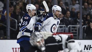 Apr 9, 2016; Los Angeles, CA, USA; Winnipeg Jets right wing Blake Wheeler (26) celebrates his game-tying goal with Jets center Mark Scheifele (55) during the third period against the Los Angeles Kings at Staples Center. The Winnipeg Jets won 4-3 in a shootout. Mandatory Credit: Kelvin Kuo-USA TODAY Sports