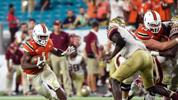 Oct 8, 2016; Miami Gardens, FL, USA; Miami Hurricanes running back Mark Walton (1) carries the ball during the first half against Florida State Seminoles at Hard Rock Stadium. Mandatory Credit: Steve Mitchell-USA TODAY Sports