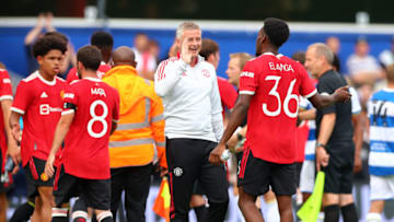 LONDON, ENGLAND - JULY 24: Manchester United Manager Ole Gunnar Solskjaer high fives Anthony Elanga of Manchester United the Pre-season Friendly between Queens Park Rangers and Manchester United at The Kiyan Prince Foundation Stadium on July 24, 2021 in London, England. (Photo by Chloe Knott - Danehouse/Getty Images)