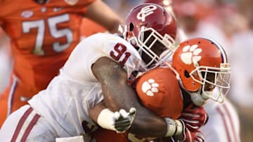 Dec 31, 2015; Miami Gardens, FL, USA; Clemson Tigers wide receiver Ray-Ray McCloud (34) is tackled by Oklahoma Sooners defensive end Charles Tapper (91) in the second quarter of the 2015 CFP Semifinal at the Orange Bowl at Sun Life Stadium. Mandatory Credit: John David Mercer-USA TODAY Sports